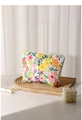 Floral canvas makeup bag with H & R BAG label on a wooden tray with lipsticks - Colorful Floral