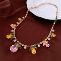 Detailed close-up of a gold necklace with colorful gemstone pendant on silk - Colorful Waterdrop Flower Fruit Necklace (19#)