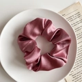 Elegant dusty pink satin scrunchie with smooth silk texture on white ceramic plate - 1076C Bean Paste Pink Satin Scrunchie