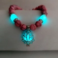 Luminous yoga bracelet with pink marble beads and glowing blue lotus flower pendant - Pink Turquoise Cyan Glow