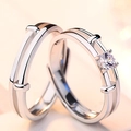Close-up of adjustable silver couple rings with double-track design and round zircon - Heartstrings