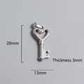 Macro detail of silver heart-shaped key pendant with 28mm height and 13mm width dimensions - Hollow Heart Key Pendant (P00211S)
