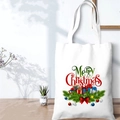 Detail of white canvas Christmas tote bag with Merry Christmas print on wooden table - SD-A-13/Colorful Xmas Elements
