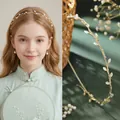 Elegante gouden bladeren haarband met witte kattenoogstenen en glanzende strass-steentjes - Kattenoog Frans Geurend Blad