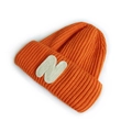 Children's ribbed knit beanie in bright orange featuring a white letter N patch - Orange