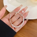 Elegant S925 sterling silver pearl splice bracelet with heart charm on a female wrist - S413 Silver - Silver Nuggets Pearl Bracelet