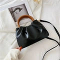 Chic black pleated cloud bag with a brown round wooden handle and crossbody strap - Black