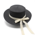 Detailed view of black woven boater hat with elegant white lace bow and spiral texture - M (56-58cm) / Black