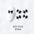 Detalle de lazos negros para manicura con borde dorado para decoración de uñas DIY - Negro