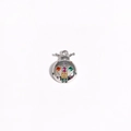 Detailed view of silver ladybug pendant with colorful inlaid gems on white background - White Gold