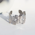 Polished silver butterfly open wide cuff bracelet with elegant 3D hollowed relief design - White Gold