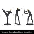 Three-piece black matte and gold resin athlete statues featuring sport poses - Golden Taekwondo Shooting Baseball Combination
