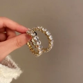 Macro shot of gold-plated hoop earrings featuring a single row of sparkling zircons - 15# 925 Sterling Silver Earring Post-Gold White Round Zirconia Hoop Earrings