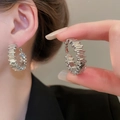 Close-up of textured irregular silver hoop earrings worn to show elegant metallic details - Silver Segmented Textured Hoop Style (111#)