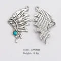 Ethnic vintage style feather pendant in antique alloy with turquoise bead inlay - Indian Headdress
