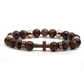Detailed macro of tiger eye beads and rose gold cross charm with black zircons - Rose Gold Tiger Eye