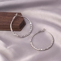 Silver twisted texture hoop earrings set on silk fabric and wooden display stand - E-009---Platinum