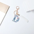 Letter D alphabet keychain with blue floral patterns and white leather tassel - Letter D (With Tassel)