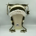 Detail of crochet cat ear hat featuring green stripes and white faux fur trim - Green and White Striped