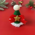 Handmade knitted Christmas hat for pets with bow and star detail on festive background - Green Christmas Star Hat