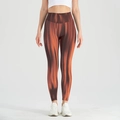 Seamless high-waist yoga leggings featuring gradient brown and orange vertical stripes - S / Brown