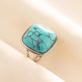 Detail shot of a square turquoise ring with black veins on silver stainless steel band - Silver Base-Light Blue Stone