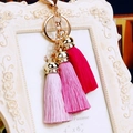 Detailed view of pink gradient silk tassels with gold metal lobster clasp and ring - Three Ice Silk Tassels / Rose Pink Gradient
