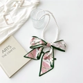 Detail of vintage pearl necklace with pink floral silk scarf on a clean white background - Calla Lily Print