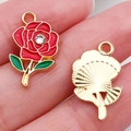 Golden rose alloy pendant with red enamel, green leaf, and rhinestone detail - Red Rhinestone Rose (16690)
