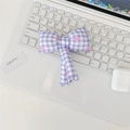 Detail of lavender checkered fabric hair bow with pink accents on a white keyboard - Purple Gingham Bowknot Accessory