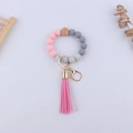 Portachiavi da polso con perle in silicone rosa e grigio e nappina in pelle sintetica - Rosa