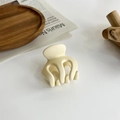 Close-up of a cream-colored matte hair claw clip on a minimalist decorative background - 5# 18081 Beige Three-pronged Hair Clip