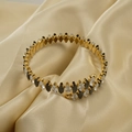 Golden wrap bangle with marquise-cut clear and black zirconias on champagne satin - White and Black