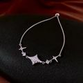 Detailed macro of silver star adjustable slider bracelet with sparkling zircon stones - Silver