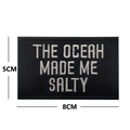 Embroidered 8x5cm tactical patch with THE OCEAN MADE ME SALTY quote in white on black - THE OCEAN MADE ME SALTY / Black with White Letters