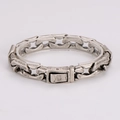 Close-up of vintage silver chain bracelet with rectangular clasp on acrylic stand - Antique Silver