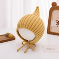 Detail of ginger yellow knitted baby pixie hat with chin straps on a white mannequin head - 46-48cm (6-15 Months) / Yellow