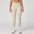 Cremefarbene High-Waist-Yogahose mit V-förmigem gekreuztem Bund und praktischen Seitentaschen - S / Haferaprikose