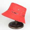 Red unisex nylon bucket hat with sport drawstring on a wooden display stand - Adjustable / Red