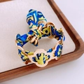 Golden clover bracelet featuring a colorful printed silk ribbon tied in a bow - Gold Daisy Printed Bow Bracelet