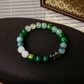 Elegant emerald green beaded bracelet with golden auspicious pattern and white accents - 41# Green Wood Element