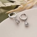 Elegant silver teardrop earrings with sparkling zircons on a natural aesthetic backdrop - Silver