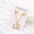 Golden stainless steel jewelry set featuring an elephant pendant necklace and matching studs - Elephant Earring Necklace Set / Gold