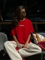 Übergroßes rotes Baumwoll-T-Shirt mit Assertive-Aufdruck in Straßenszene - S / Rot