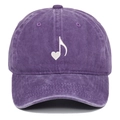 Macro view of purple washed cotton baseball cap with white heart music note embroidery - Purple