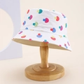 Detail view of cotton sun hat with colorful patterns on a wooden display stand - Kids One Size / White (Colorful Semi-circle)
