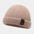 Winter ribbed knit beanie in beige featuring a lion shield logo patch for outdoor warmth - One Size / Khaki