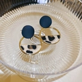 Detail of geometric leopard print earrings with gold rings in a textured glass bowl - Coffee Painted Semicircle Leopard (Steel Post)