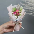 Close-up of a mini pink rose and baby's breath dried flower bouquet with a Best Wishes tag - Pink Rose (Pink Wrapping)