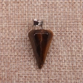 Detail shot of tiger eye stone hexagonal pillar pendant on textured linen background - Tiger Eye Stone Bracelet